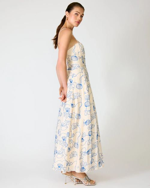 Woman wearing a floral dress on a white background