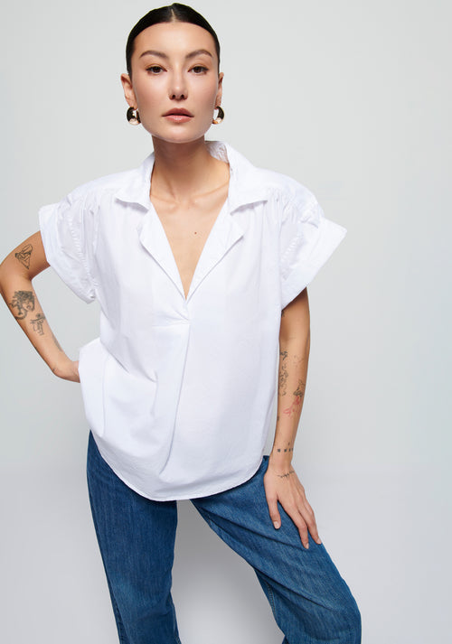 White cotton shirt with cuffed shirt sleeves, and shirt tail back
