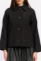 Black coat with a collar and buttons on a white background