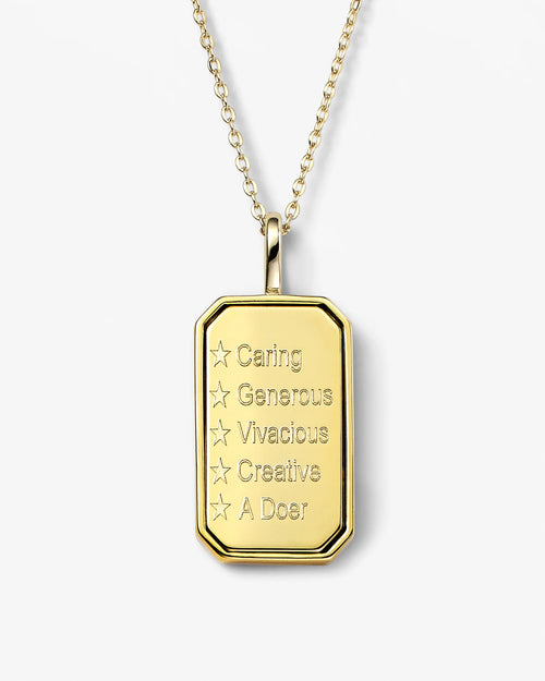 Gold pendant necklace with engraved text on a white background