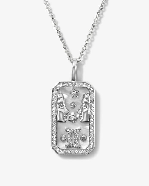 Silver pendant necklace with zodiac design on a white background