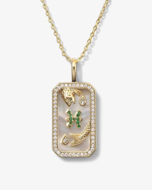 Gold necklace with a rectangular pendant featuring emeralds and gold accents on a white background
