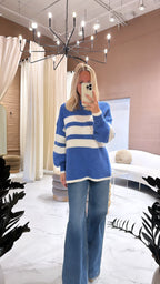 Women’s blue mock neck, sweater with three white horizontal stripes. Sizes extra small to large. ￼