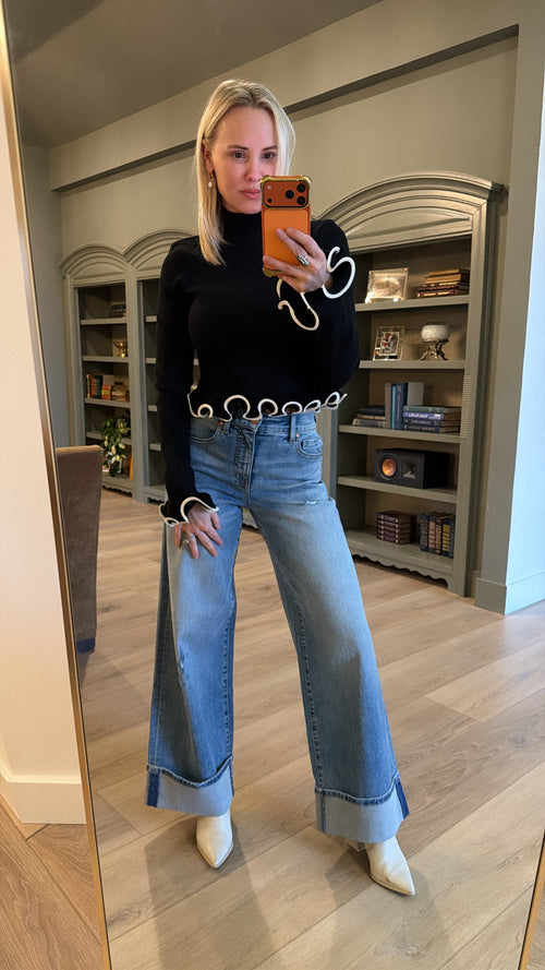 Lacey Ruffle Turtleneck Sweater in black