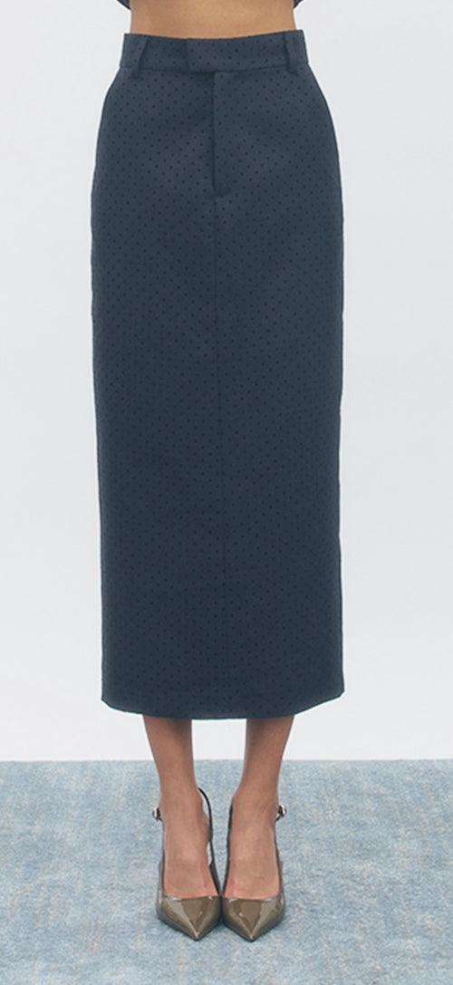 Dark gray pencil skirt worn by a person on a white background