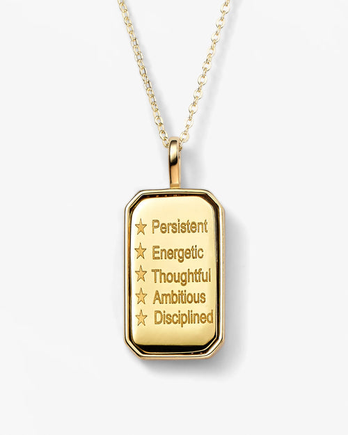 Gold pendant necklace with motivational words on a white background