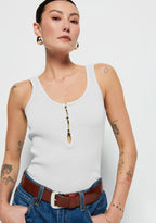 White ribbed tank top with three flat gold buttons for decoration full length top