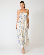 Woman wearing a floral dress on a white background