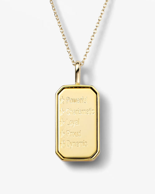 Gold pendant necklace with engraved text on a white background